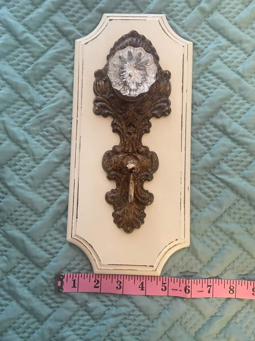 Decorative Cream Wall Hook with Vintage Bronze Colored Accent and Acrylic Knob